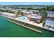 Stunning aerial view showcasing the pool, docks, and waterfront community at 4799 Coquina Key Se Dr, St Petersburg, FL 33705