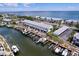 Beautiful aerial view featuring boat docks and waterfront condos with scenic ocean views at 4799 Coquina Key Se Dr, St Petersburg, FL 33705