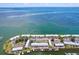 A scenic aerial view of waterfront property featuring docks and lush green landscaping at 4799 Coquina Key Se Dr, St Petersburg, FL 33705