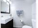 Modern powder room with a unique vessel sink, stylish fixtures and decor at 4799 Coquina Key Se Dr, St Petersburg, FL 33705