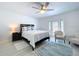 Bright bedroom with a ceiling fan, decor rug and a door to the outside at 4799 Coquina Key Se Dr, St Petersburg, FL 33705
