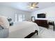 Spacious bedroom featuring ample closet space, a ceiling fan and a door to the outside at 4799 Coquina Key Se Dr, St Petersburg, FL 33705