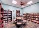 Cozy library with bookshelves and a table with chairs for reading at 4799 Coquina Key Se Dr, St Petersburg, FL 33705