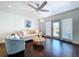 Bright and airy living room with access to the screened lanai through sliding glass doors at 4799 Coquina Key Se Dr, St Petersburg, FL 33705