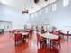 Large meeting room with tables, chairs, and natural light for community gatherings at 4799 Coquina Key Se Dr, St Petersburg, FL 33705