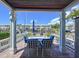 Brick patio with outdoor seating, offering serene views of the boat dock and waterfront at 4799 Coquina Key Se Dr, St Petersburg, FL 33705