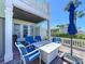 Outdoor patio area with brick flooring, comfortable seating, and a modern white fire pit table at 4799 Coquina Key Se Dr, St Petersburg, FL 33705