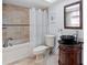 Well-appointed bathroom featuring travertine tile, modern fixtures, and a cozy bathtub at 4900 Brittany S Dr # 1414, St Petersburg, FL 33715