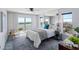 Bright bedroom featuring balcony access, water views, and modern furnishings for comfortable living at 4900 Brittany S Dr # 1414, St Petersburg, FL 33715