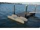 Private boat dock with floating platform and ladder provides convenient water access for boating and recreation at 4900 Brittany S Dr # 1414, St Petersburg, FL 33715