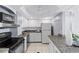 Efficient kitchen featuring white cabinetry, modern appliances, and durable countertops at 4900 Brittany S Dr # 1414, St Petersburg, FL 33715