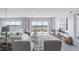Bright living room showcasing panoramic water views from expansive sliding glass doors at 4900 Brittany S Dr # 1414, St Petersburg, FL 33715