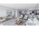 Bright living room features modern furnishings and access to dining area at 4900 Brittany S Dr # 1414, St Petersburg, FL 33715