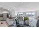 Bright, open-concept living space with water views, modern decor, and sleek barstool seating at 4900 Brittany S Dr # 1414, St Petersburg, FL 33715