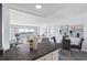 Open-concept living space with great water views, modern decor, and a dining area at 4900 Brittany S Dr # 1414, St Petersburg, FL 33715