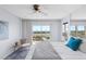Bright bedroom with water views, a private balcony, and modern furnishings at 4900 Brittany S Dr # 1414, St Petersburg, FL 33715