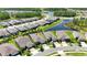 An aerial view of a well-maintained home nestled in a community with ponds and lush greenery at 5597 Bay Tide Ct, Land O Lakes, FL 34638