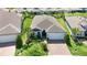 Beautiful single-story home with brick driveway, lush landscaping, and a well-manicured lawn at 5597 Bay Tide Ct, Land O Lakes, FL 34638
