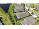Aerial view of the house with a screened-in lanai and waterfront view at 5597 Bay Tide Ct, Land O Lakes, FL 34638