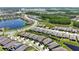 Aerial view of Meridian Amenities Center community featuring lake, walking trail, water feature, and pool at 5597 Bay Tide Ct, Land O Lakes, FL 34638
