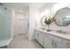 Spacious bathroom with double sinks, modern fixtures, and a glass-enclosed shower at 5597 Bay Tide Ct, Land O Lakes, FL 34638