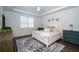 Stylish bedroom with tray ceiling, white plantation shutters, and elegant decor at 5597 Bay Tide Ct, Land O Lakes, FL 34638