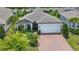 Inviting single-Gathering home boasts beautiful landscaping, a two-car garage, and an attractive facade at 5597 Bay Tide Ct, Land O Lakes, FL 34638