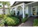 Inviting front porch with rocking chairs and lush landscaping offers a relaxing outdoor space at 5597 Bay Tide Ct, Land O Lakes, FL 34638
