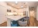 Bright kitchen features an island with seating, stainless steel appliances, and stylish pendant lighting at 5597 Bay Tide Ct, Land O Lakes, FL 34638