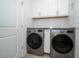Laundry room featuring stainless steel washer and dryer at 5597 Bay Tide Ct, Land O Lakes, FL 34638