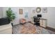 Cozy office space with a stylish rug, comfortable seating, and ample natural light at 5597 Bay Tide Ct, Land O Lakes, FL 34638
