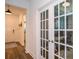 Bright office space featuring glass French doors, stylish decor, and wood flooring, perfect for working at 5597 Bay Tide Ct, Land O Lakes, FL 34638