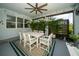 Charming covered patio with a large dining table, comfortable seating for six, and ample sunlight at 5597 Bay Tide Ct, Land O Lakes, FL 34638