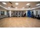 Spacious studio with hardwood floors, exercise equipment, and mirrored walls, perfect for fitness activities at 5597 Bay Tide Ct, Land O Lakes, FL 34638