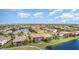 An aerial view of suburban homes with screened lanais surrounding multiple bodies of water at 5656 Cloverleaf Run, Bradenton, FL 34211