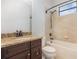 Bathroom features granite countertop, dark wood cabinets, and shower with bathtub at 5656 Cloverleaf Run, Bradenton, FL 34211