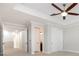 Bedroom features neutral carpet, tray ceiling, and entryways to hallway and bathroom at 5656 Cloverleaf Run, Bradenton, FL 34211