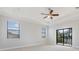 Bright bedroom with carpet flooring, tray ceiling and a ceiling fan at 5656 Cloverleaf Run, Bradenton, FL 34211