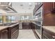 Gourmet kitchen featuring stainless steel appliances, granite countertops and a gas range stove at 5656 Cloverleaf Run, Bradenton, FL 34211