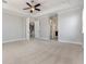 Large main bedroom with neutral paint, carpet flooring, a ceiling fan and plenty of natural light at 5656 Cloverleaf Run, Bradenton, FL 34211