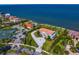 Aerial view of a waterfront estate featuring manicured grounds and circular driveway at 6106 Marbella Blvd, Apollo Beach, FL 33572