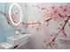 Chic powder room showcases a modern sink and vanity with colorful floral wallpaper at 6106 Marbella Blvd, Apollo Beach, FL 33572