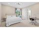 Cozy bedroom boasts ample natural light, neutral carpet, and a convenient desk space at 6106 Marbella Blvd, Apollo Beach, FL 33572