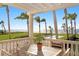 Inviting lanai with comfortable seating, perfect for enjoying serene water views and tropical breezes at 6106 Marbella Blvd, Apollo Beach, FL 33572