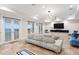 Bright living room boasting french doors to the water, recessed lights, and ample seating for relaxed living at 6106 Marbella Blvd, Apollo Beach, FL 33572