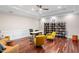 Spacious office includes hardwood floors, modern lighting, built-in shelving, and comfortable seating at 6106 Marbella Blvd, Apollo Beach, FL 33572