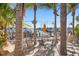 Relaxing outdoor seating area with palm trees and marina views at 6106 Marbella Blvd, Apollo Beach, FL 33572