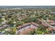 Wide aerial perspective of a residential community featuring ample green space and convenient parking at 6408 Bonnie Bay N Cir, Pinellas Park, FL 33781