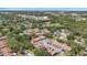 Community aerial shot showcases multiple units and extensive landscaping, highlighting neighborhood charm at 6408 Bonnie Bay N Cir, Pinellas Park, FL 33781
