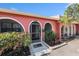 Inviting single-story home featuring an arched entryway, well-maintained landscaping and a tranquil and private setting at 6408 Bonnie Bay N Cir, Pinellas Park, FL 33781